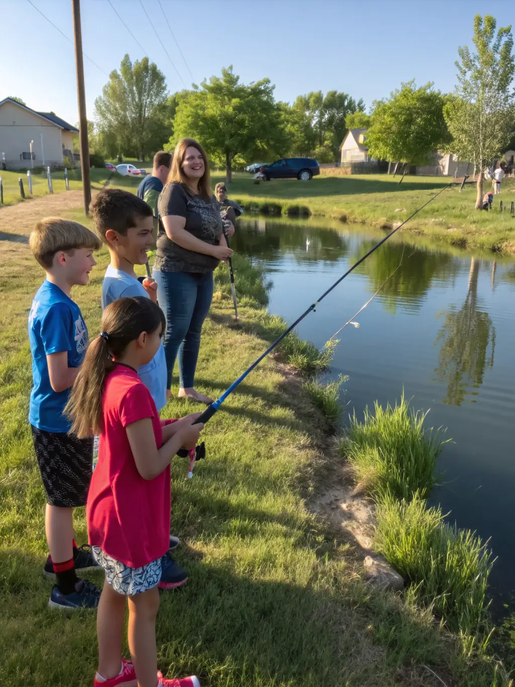 A picture of children participating in a fishing derby, smiling and holding up their catches, highlighting the family-friendly nature of the event.